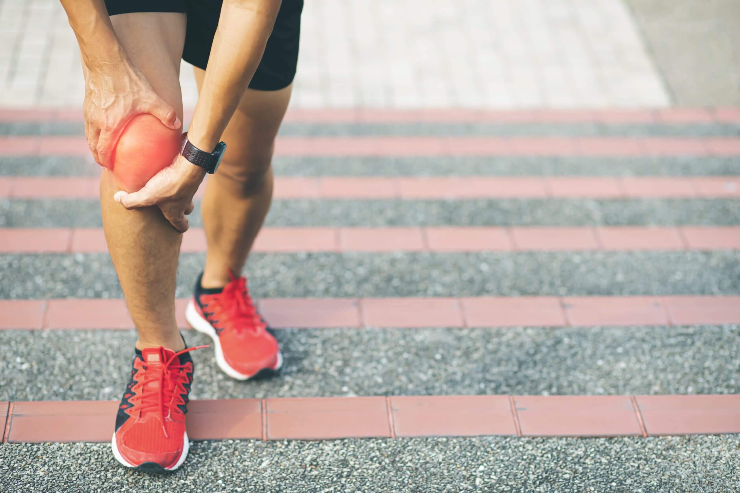 Woman holding her Common Knee Injuries